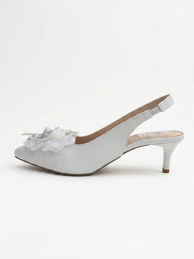 "Sparkle-ready white slingback heels with a crystal bow detail. Comfy kitten heel, timeless pointed toe. Shop bridal & nikah night must-haves now.
