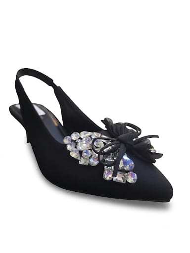 "Sparkle-ready white slingback heels with a crystal bow detail. Comfy kitten heel, timeless pointed toe. Shop bridal & nikah night must-haves now.
